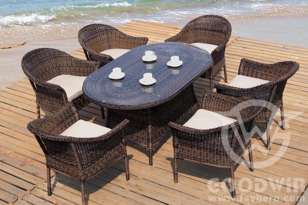 Wicker Outdoor Dining Set with Oval Glass Table and Six Cushioned Chairs