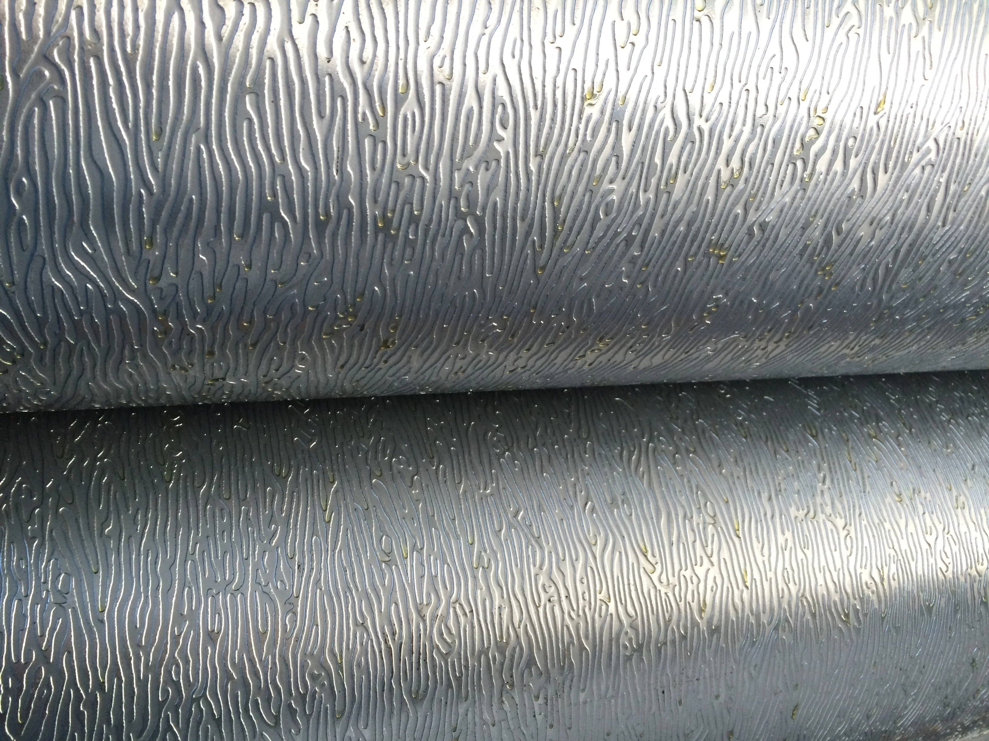 Detail view of the heavy-duty embossing rollers