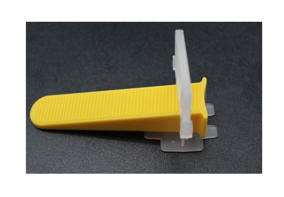 Tile leveling system with yellow wedge and clear clip