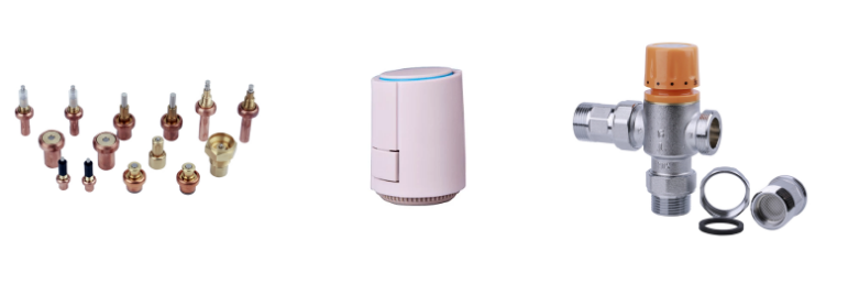 Complete underfloor heating system components including thermostats and manifold.