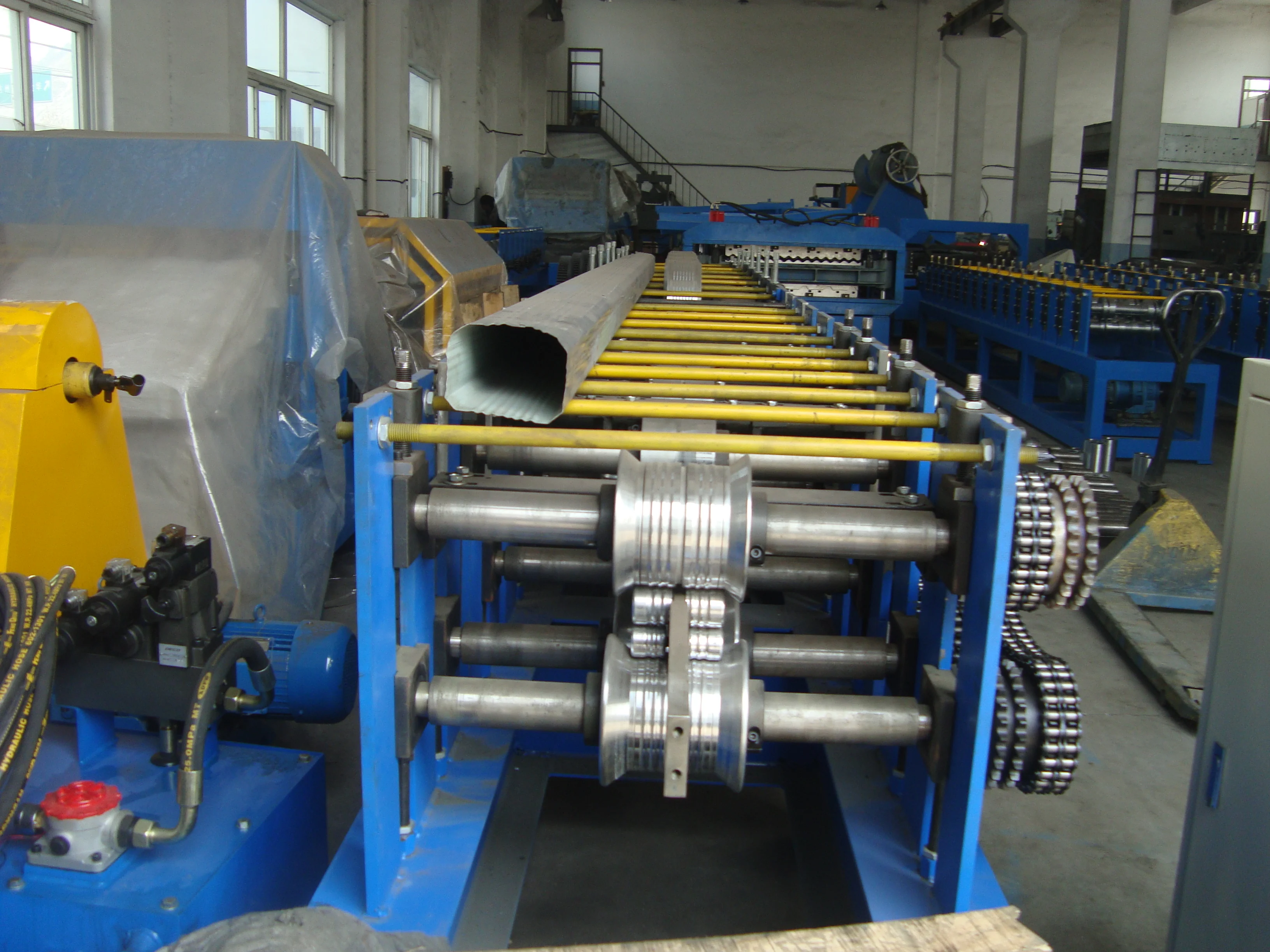 Close up of hydraulic hoses and rollers