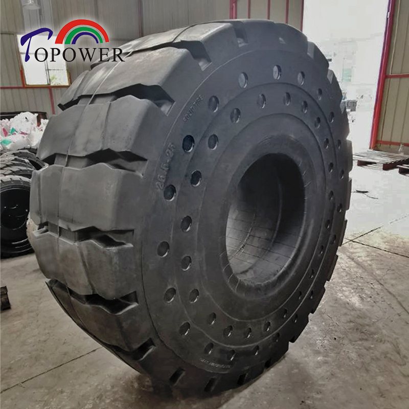 Solid rubber tire detail showing size 26.5-25