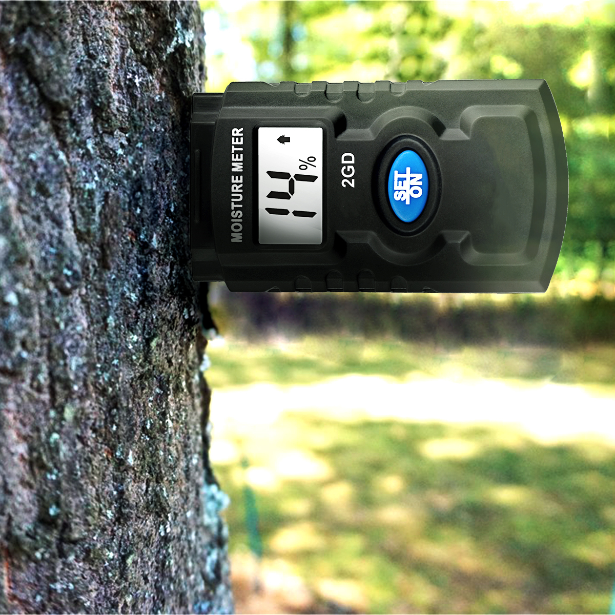Compact digital moisture meter being held