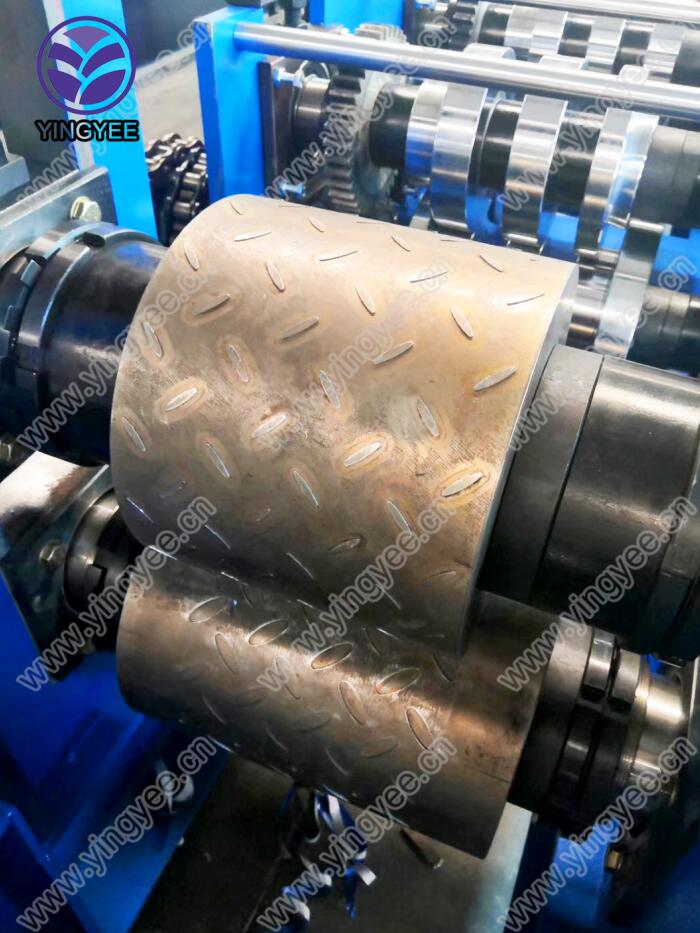 Close up of the embossing rollers showing the textured surface