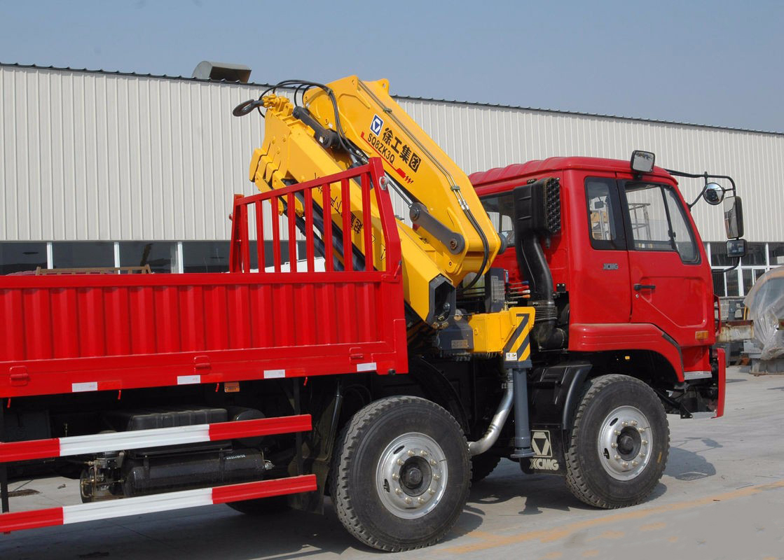 Side profile of the 8-ton hydraulic knuckle boom crane mounted on a truck chassis.