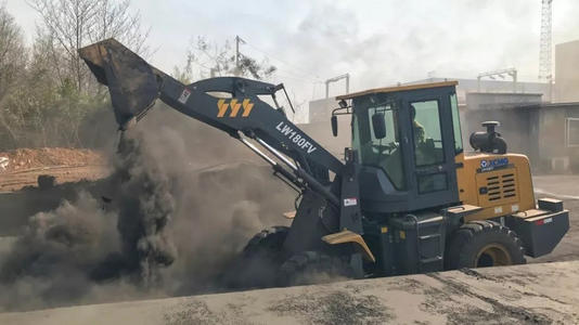 Mini wheel loader performing earthmoving tasks