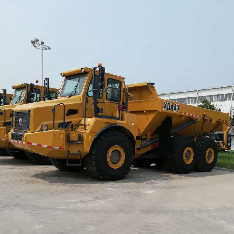 Action shot of the articulated dump truck navigating terrain