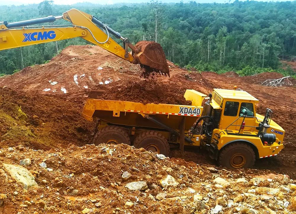 Front view of the mining dump truck in a working environment