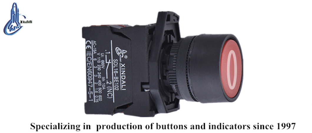 Close up of the red push button actuator