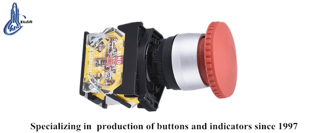 Industrial push button switch on a control panel