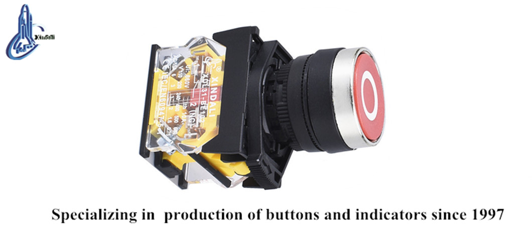 Close up of red metal flush push button switch