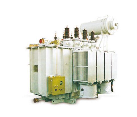 Side view of oil-immersed power transformer with cooling radiators