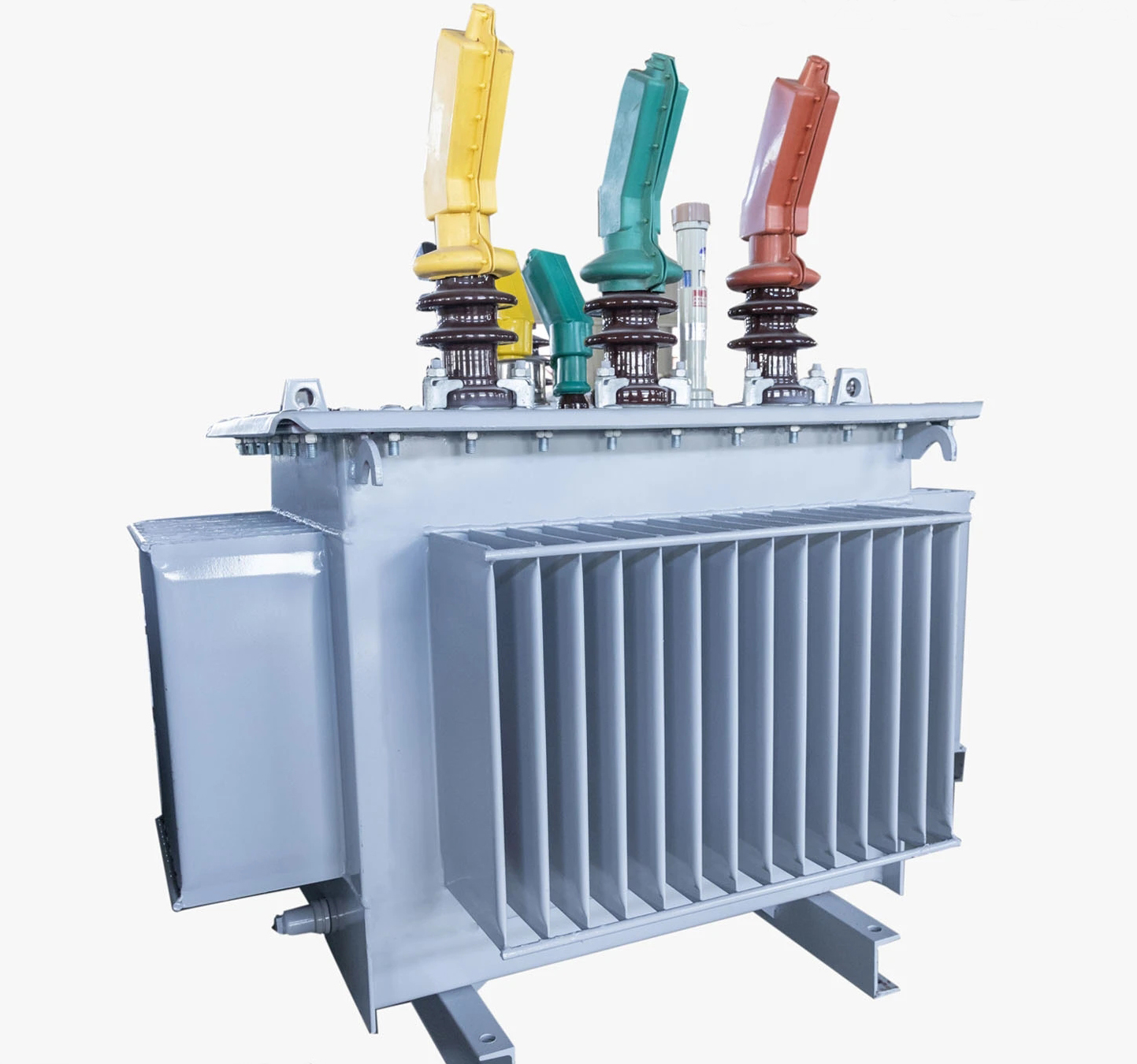 Transformer showing cooling fins and phase bushings