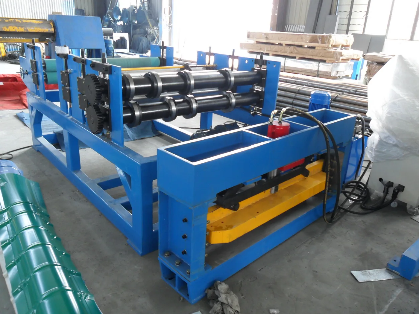 Close up view of the steel processing rollers and cutting mechanism