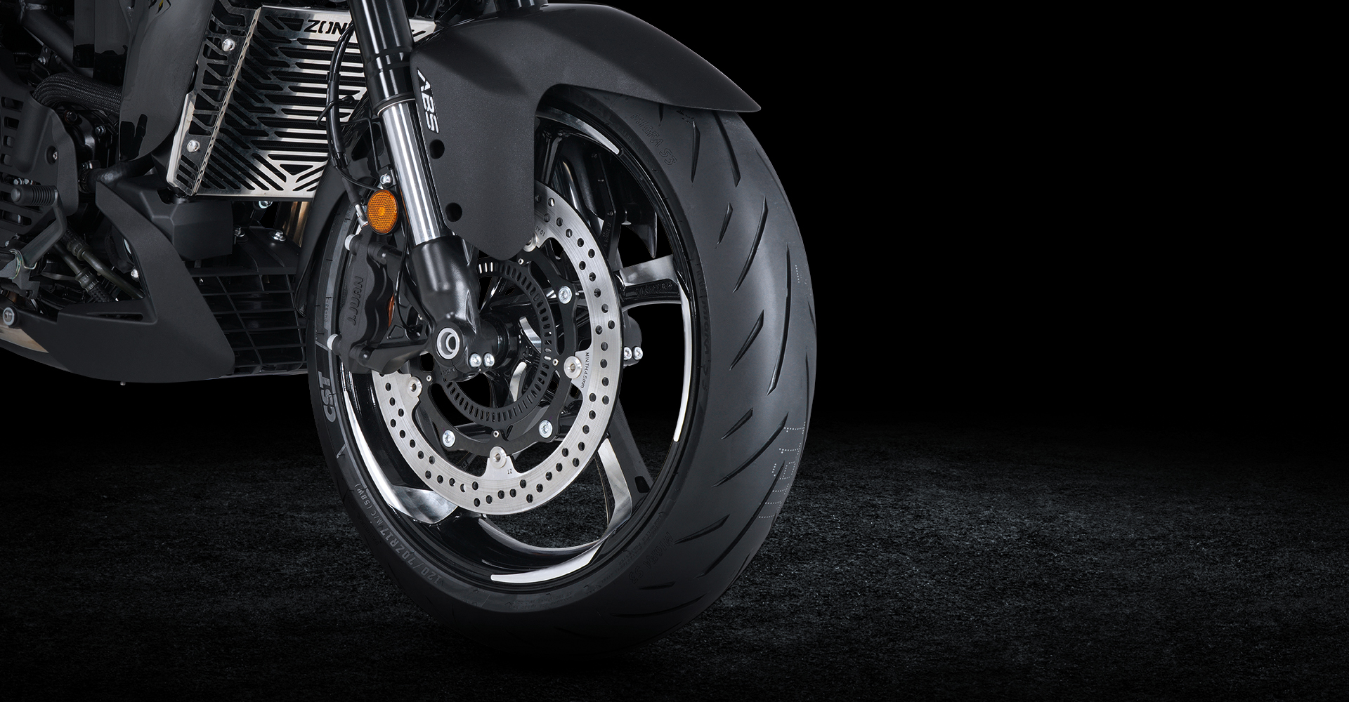 Close up of front wheel with ABS and disc brake system